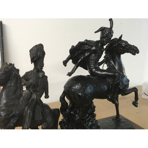 841 - A figure in the form of a Hussar cavalry officer on horseback together with One other figure on hors... 