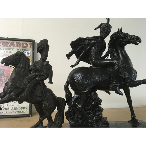841 - A figure in the form of a Hussar cavalry officer on horseback together with One other figure on hors... 
