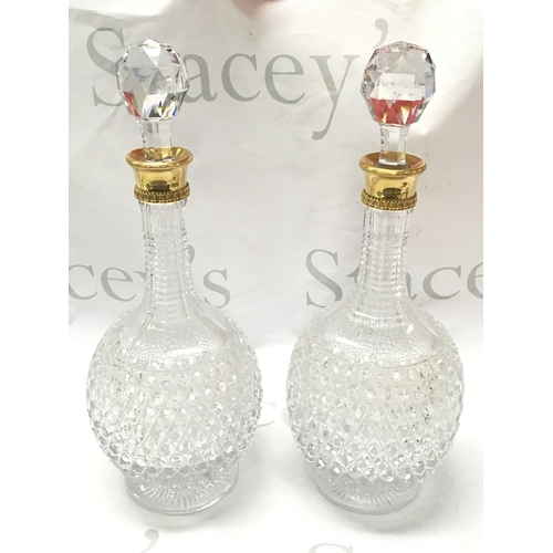 869 - A pair of fine quality 18ct gold rim and cut glass Asprey decanters ,33cm tall. This lot cannot be p... 