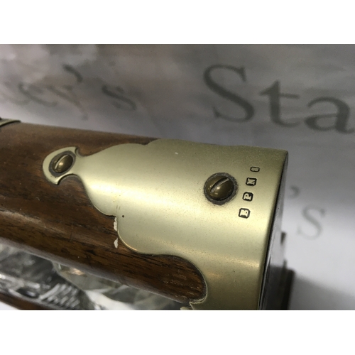 875 - An oak and silver plated three glass decanter tantalus ,37cm wide 35cm tall. This lot cannot be post... 