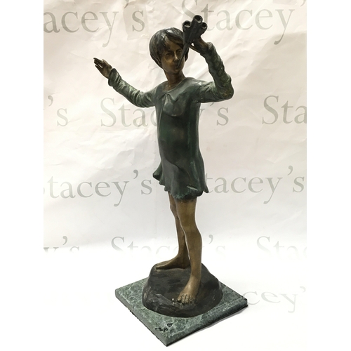 877 - A bronze figure