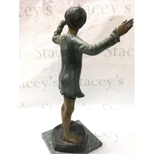 877 - A bronze figure