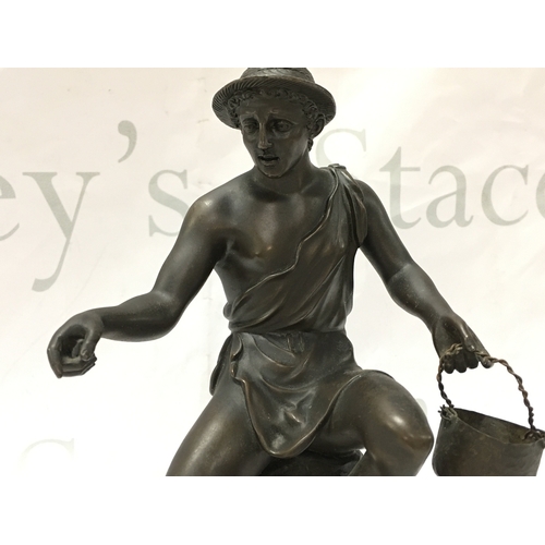 886 - A 19th century bronze of a Neoclassical fisherman. 22cm tall. Postage category B