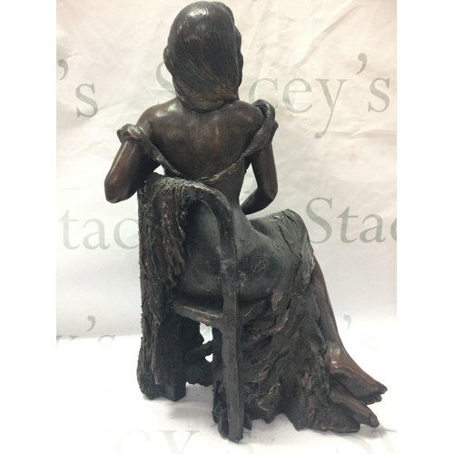 890 - A limited edition simulated cold browned cast figure seated lady with a certificate of authenticity ... 