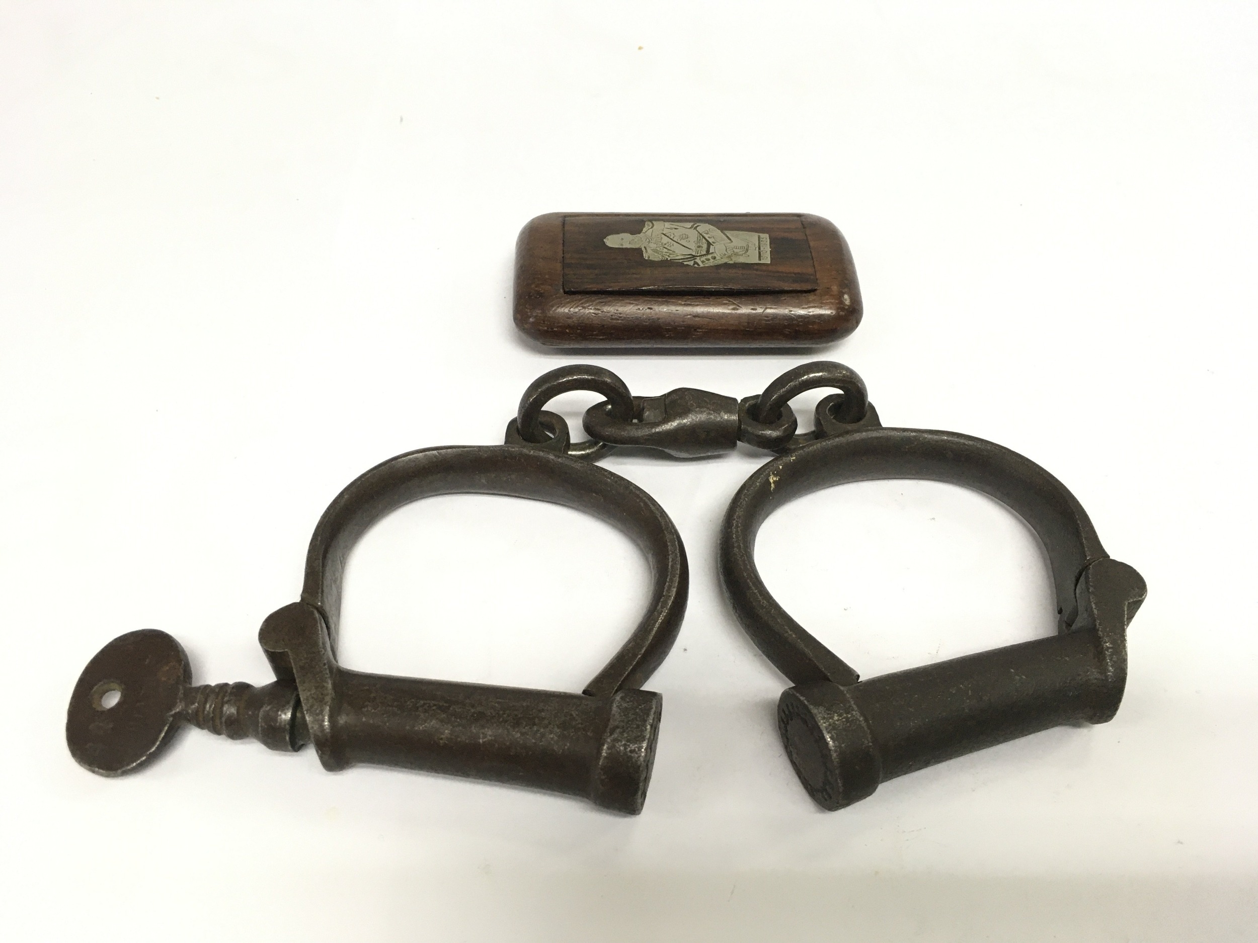 A pair of Victorian handcuffs and an inlaid snuff box (2). Shipping ...