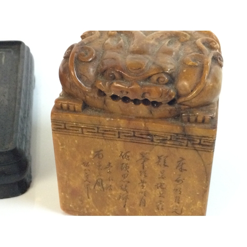 915 - Two Chinese wooden and stone Fu dog stamp seals. 6 and 15cm tall. Postage category B