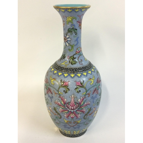917 - A Chinese Cantonese Turquoise vase with a four character mark at base. 21cm tall.