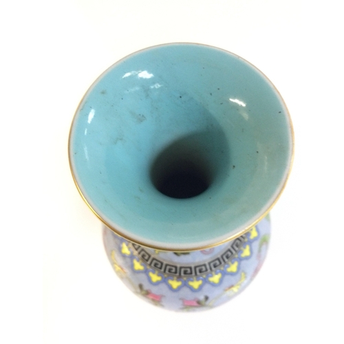 917 - A Chinese Cantonese Turquoise vase with a four character mark at base. 21cm tall.
