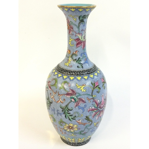 917 - A Chinese Cantonese Turquoise vase with a four character mark at base. 21cm tall.