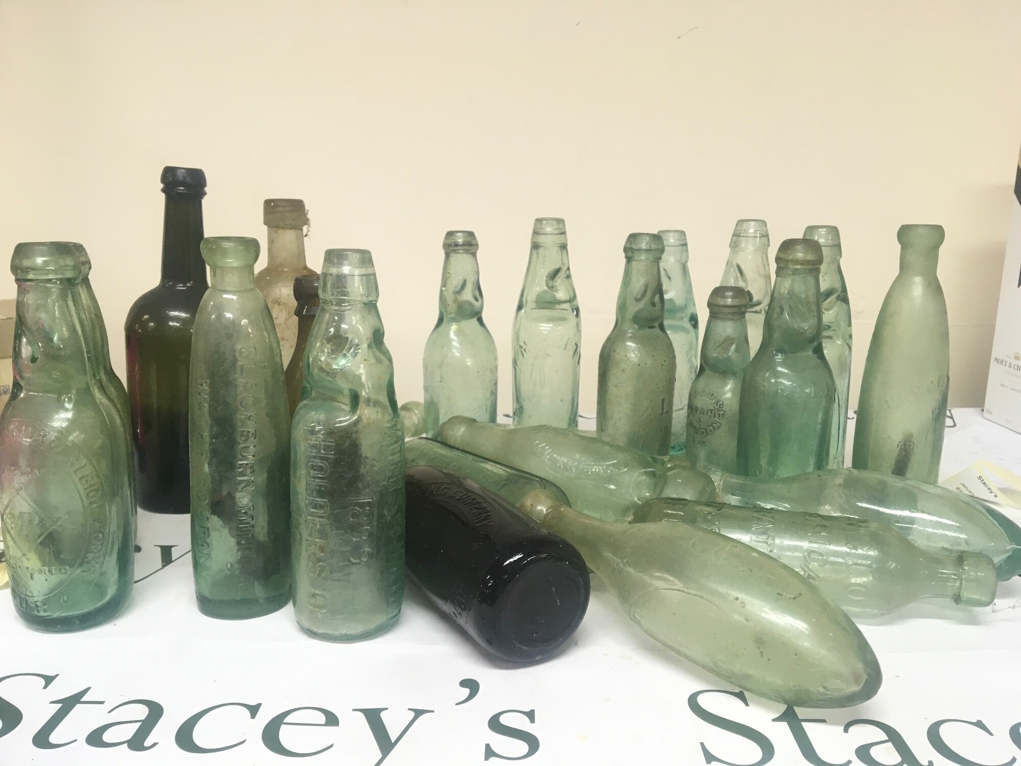 A collection of Victorian and later glass bottles Cod Bottles and ...