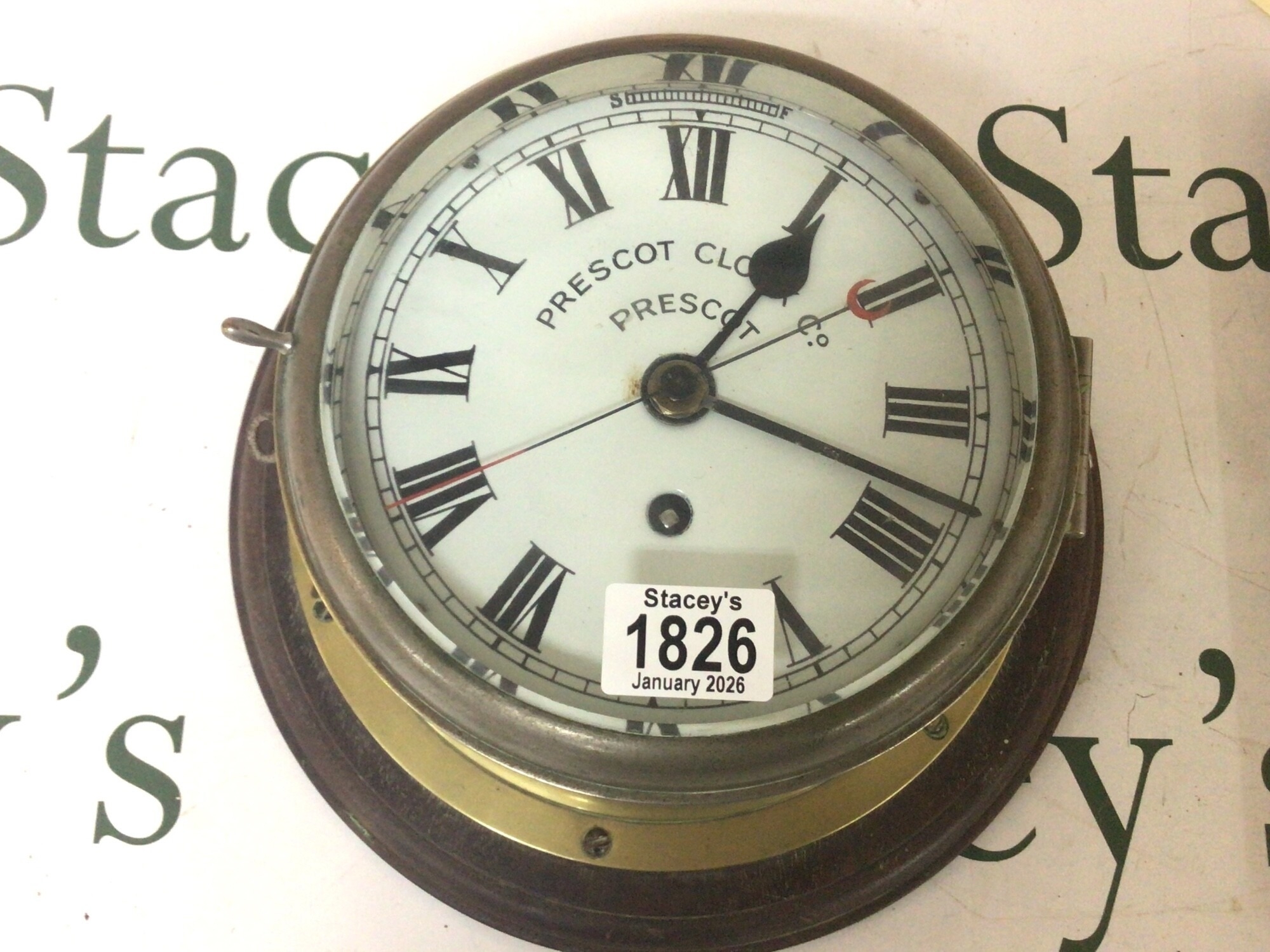 A Nice example of a Prescot ships clock in a brass case enamel dial ...