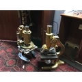 A prior microscope and one other both a fitted wooden Prior case