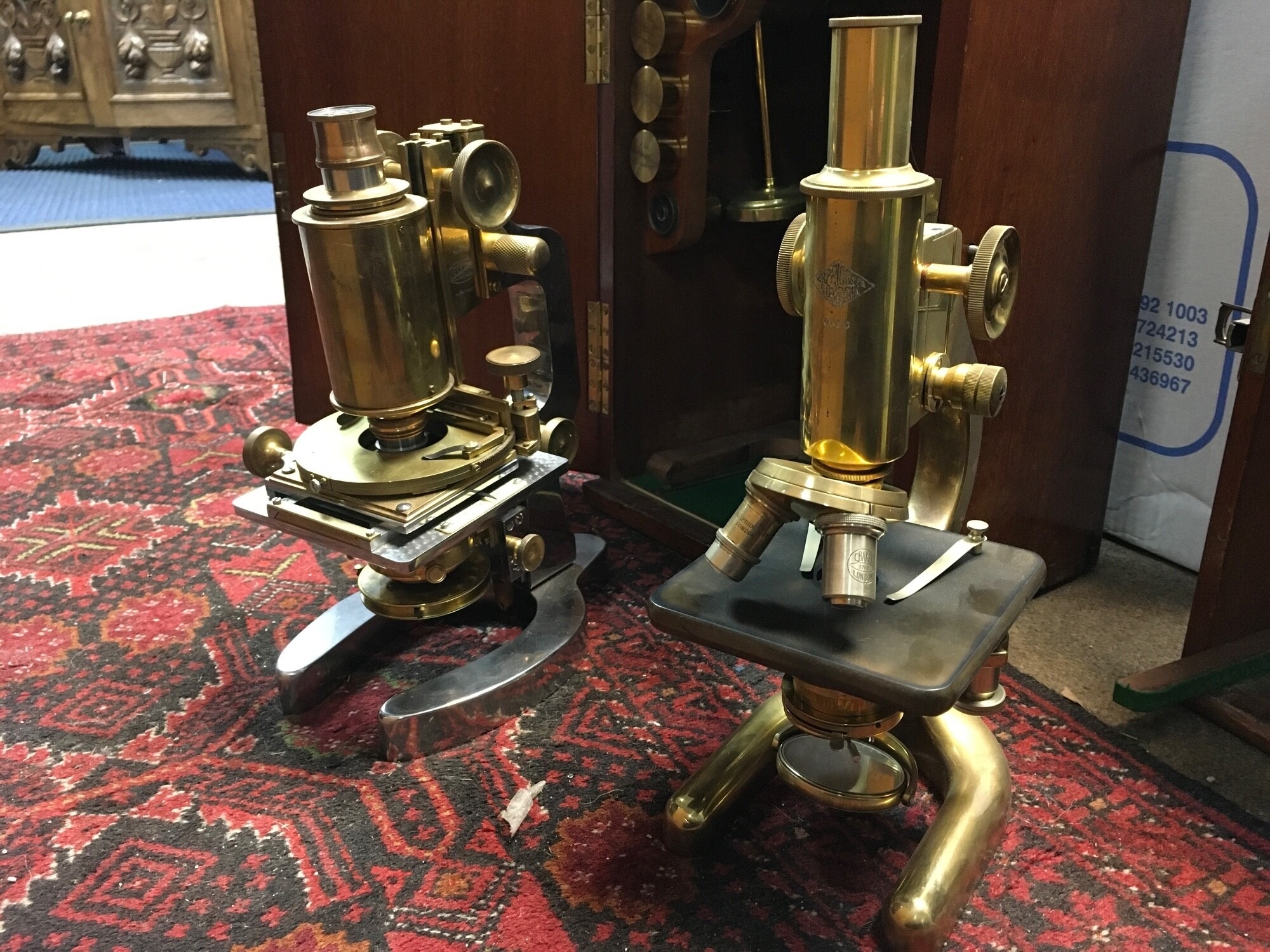 A prior microscope and one other both a fitted wooden Prior case