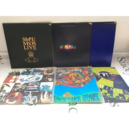305 - Thirteen LPs by various artists including Simple Minds, Big Country, U2 and others.