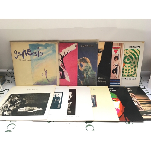 306 - Two bags containing 23 rock & pop LPs and 12