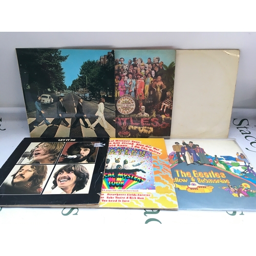 326 - Six Beatles LPs comprising early UK pressings of Abbey Road, Sgt Pepper, Yellow Submarine and others... 