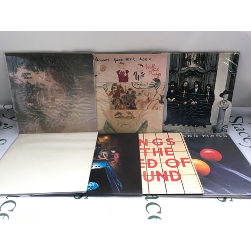 339 - Seven Beatles and related LPs comprising the White Album, Venus And Mars, Walls And Bridges and othe... 