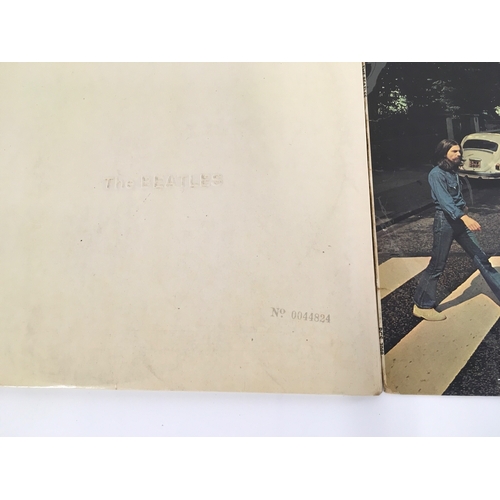 409 - A numbered Beatles White Album (no inserts) 0044824 plus an early pressing of Abbey Road (2). Some s... 