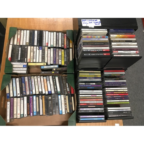 419 - A collection of CDs and audio cassettes by various artists including Elvis Presley, Adam & The Ants,... 