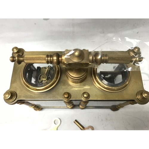 835 - A French brass and cloisonné clock barometer, 13.5cm tall 13cm wide. Seen working . Two keys