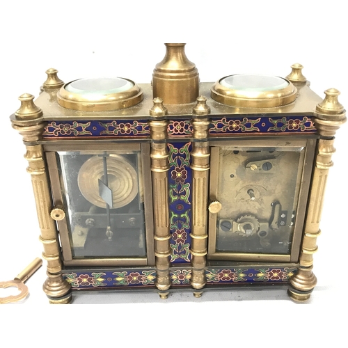 835 - A French brass and cloisonné clock barometer, 13.5cm tall 13cm wide. Seen working . Two keys