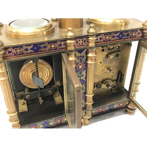 835 - A French brass and cloisonné clock barometer, 13.5cm tall 13cm wide. Seen working . Two keys