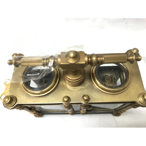 835 - A French brass and cloisonné clock barometer, 13.5cm tall 13cm wide. Seen working . Two keys