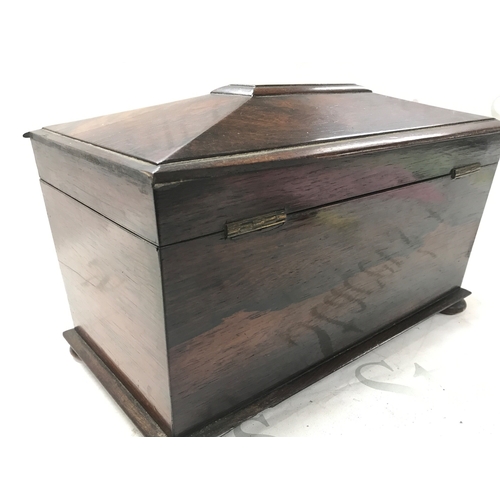 844 - A rosewood tea caddy. 32cm wide, 20cm tall 17cm deep