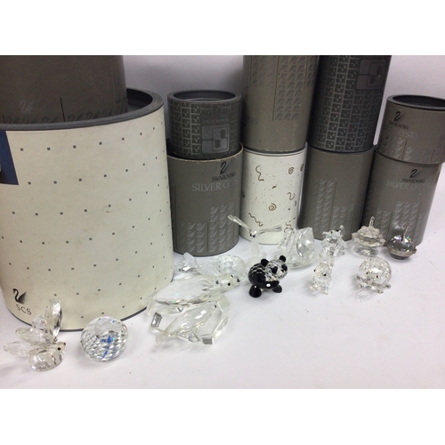1017 - A collection of boxed Swarovski crystal glass figures