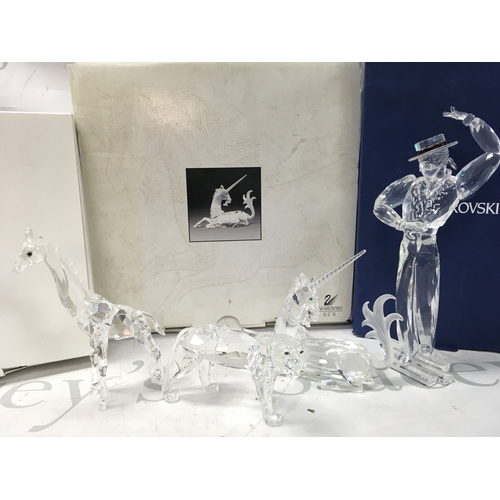 1020 - Four boxed Swarovski crystal glass figures including 2003 SCS Annual Edition 