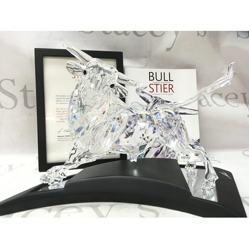 1022 - A cased Swarovski Crystal 2004 bull figure. Limited edition number 2587 of 10000. Designed by Adi St... 