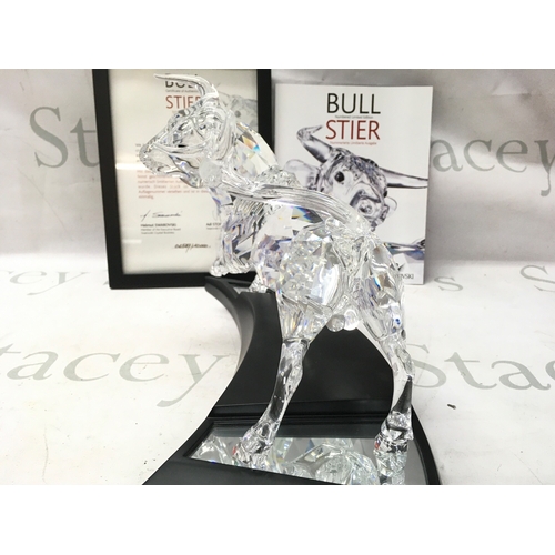 1022 - A cased Swarovski Crystal 2004 bull figure. Limited edition number 2587 of 10000. Designed by Adi St... 