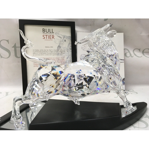 1022 - A cased Swarovski Crystal 2004 bull figure. Limited edition number 2587 of 10000. Designed by Adi St... 