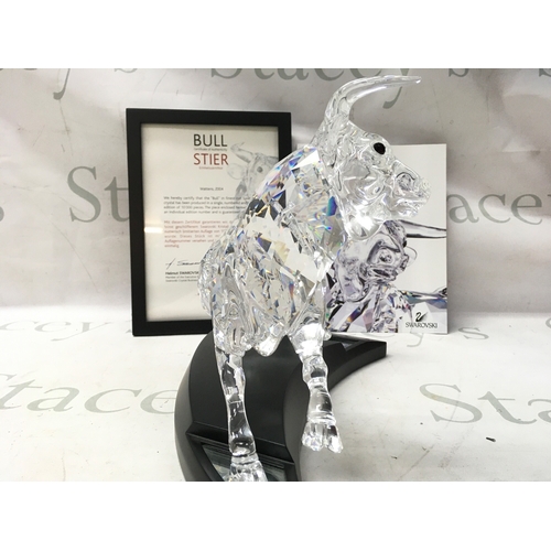 1022 - A cased Swarovski Crystal 2004 bull figure. Limited edition number 2587 of 10000. Designed by Adi St... 