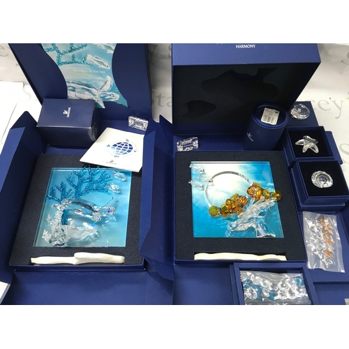 1024 - Swarovski crystal glass two boxed wonders of the sea figure groups Harmony and Eternity , also inclu... 