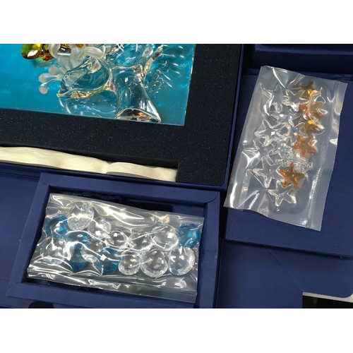 1024 - Swarovski crystal glass two boxed wonders of the sea figure groups Harmony and Eternity , also inclu... 