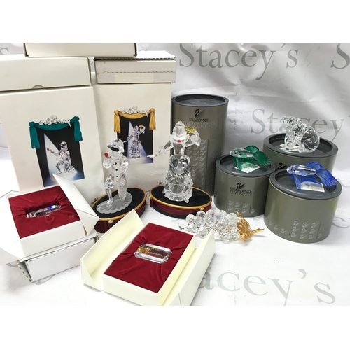 1026 - A Collection of boxed Swarovski crystal glass figures including Masquerade Columbine and Harlequin w... 
