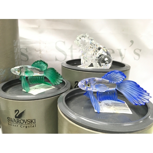 1026 - A Collection of boxed Swarovski crystal glass figures including Masquerade Columbine and Harlequin w... 