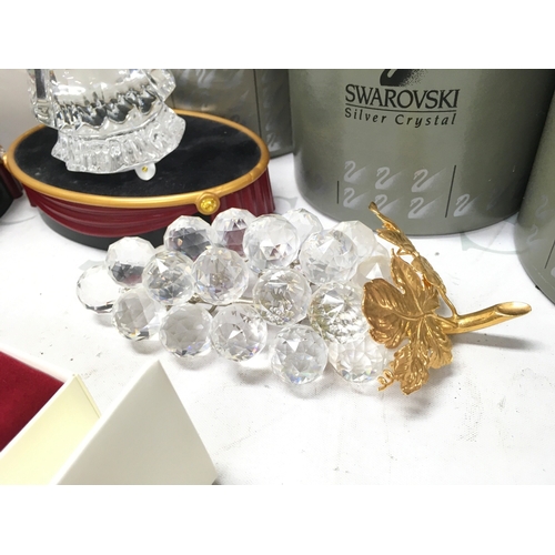1026 - A Collection of boxed Swarovski crystal glass figures including Masquerade Columbine and Harlequin w... 