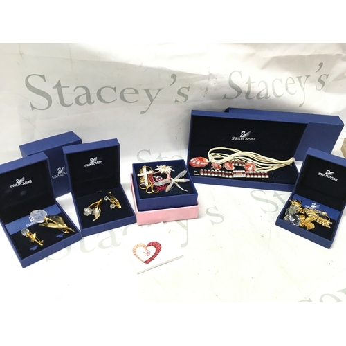 1101 - A collection of Swarovski boxed jewellery including brooches, necklace, earrings etc