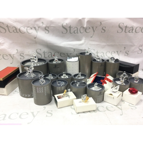 1103 - A collection of boxed Swarovski figures , no reserve