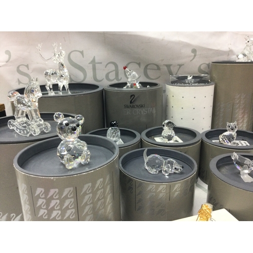 1103 - A collection of boxed Swarovski figures , no reserve