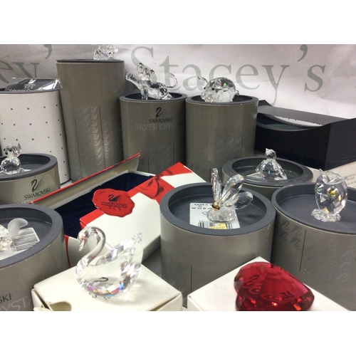 1103 - A collection of boxed Swarovski figures , no reserve