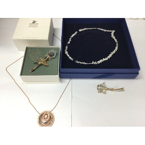 1109 - Four items of Swarovski crystal jewellery including two necklaces and two brooches