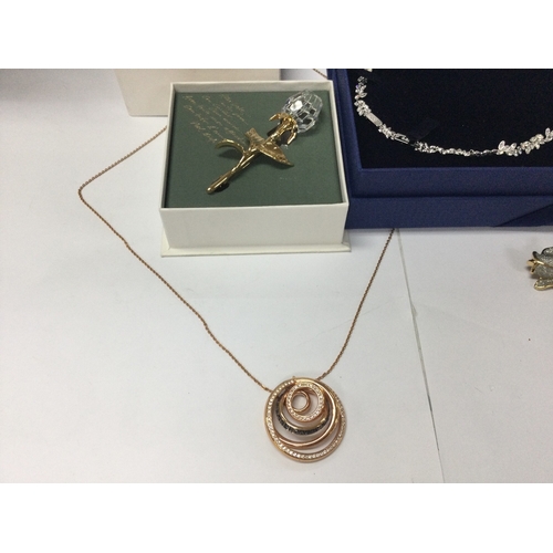 1109 - Four items of Swarovski crystal jewellery including two necklaces and two brooches
