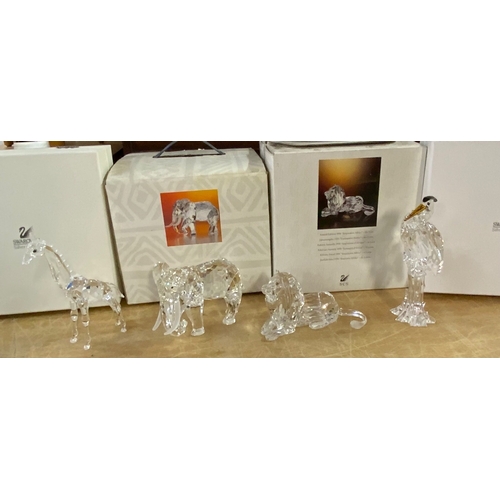 1110 - Swarovski figures (all in good condition), African Lion, African Elephant, Crane, Giraffe.