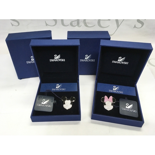 1115 - A boxed pair of Swarovski Mickey & Minnie Mouse brooches (2).