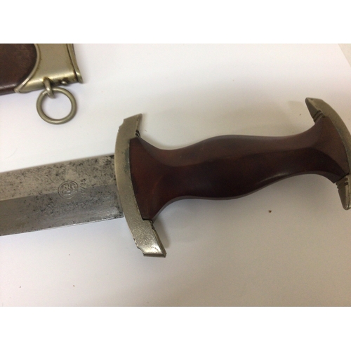 606 - A German Third Reich Genuine SA presentation dagger the walnut grip with red SA symbol inset engrave... 