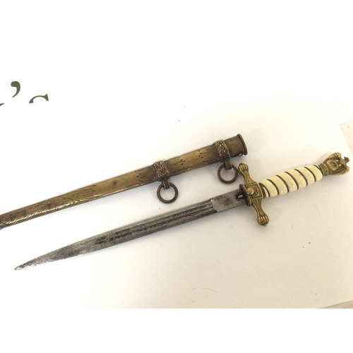 607 - A German Third Reich II world war Kriegsmarine Presentation officers dagger with brass eagle pommel ... 