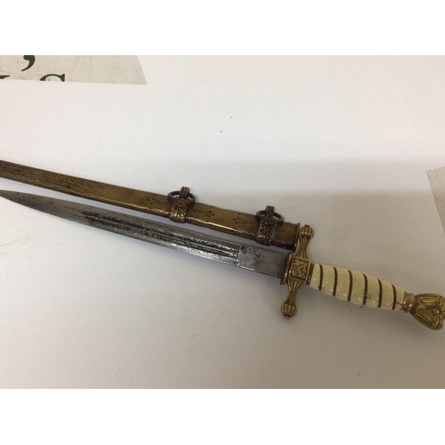 607 - A German Third Reich II world war Kriegsmarine Presentation officers dagger with brass eagle pommel ... 